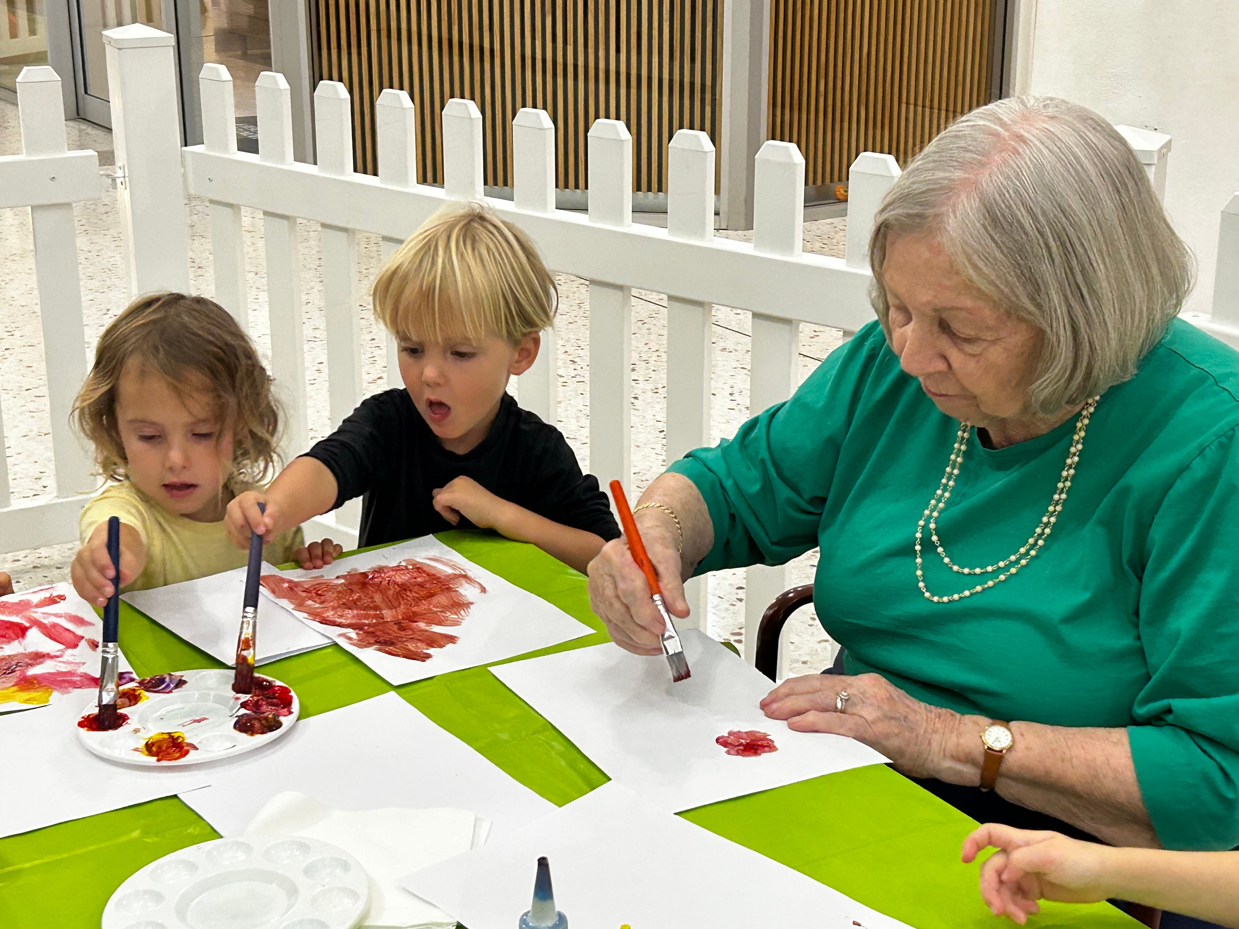 Intergen 180325 Julia painting with friends